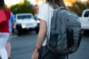 woman using gray backpack